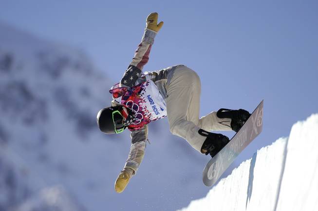 Shaun White of the United States jumps during a training session for the men's snowboard halfpipe at the 2014 Winter Olympics on Saturday, Feb. 8, 2014, in Krasnaya Polyana, Russia.