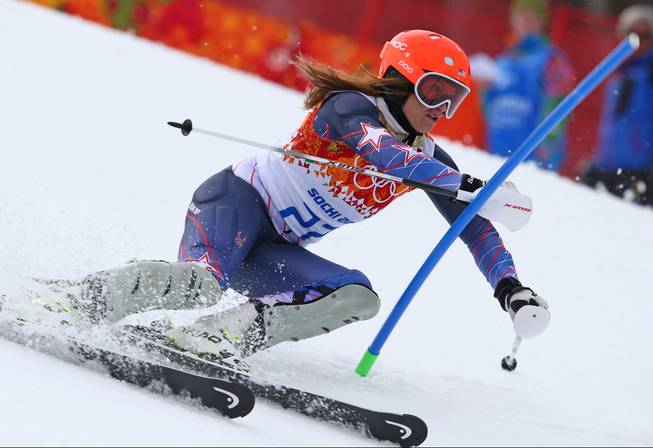 United States' Julia Mancuso passes a gate in the slalom portion of the women's supercombined to win the bronze medal in the Sochi 2014 Winter Olympics, Monday, Feb. 10, 2014, in Krasnaya Polyana, Russia.