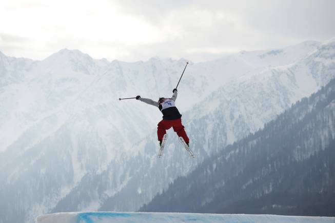 Devin Logan of the United States takes a jump during the women's freestyle skiing slopestyle qualifying at the Rosa Khutor Extreme Park, at the 2014 Winter Olympics, Tuesday, Feb. 11, 2014, in Krasnaya Polyana, Russia. 