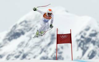 United States' Bode Miller  makes a jump during Men's super combined downhill training at the Sochi 2014 Winter Olympics, Tuesday, Feb. 11, 2014, in Krasnaya Polyana, Russia. 