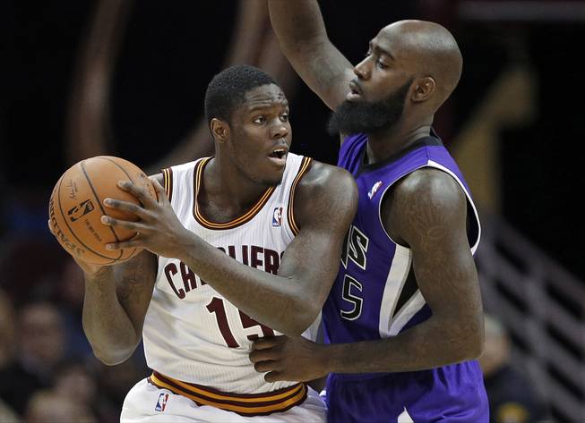 Cleveland Cavaliers' Anthony Bennett, left, tries to get past Sacramento Kings' Quincy Acy during the third quarter of an NBA basketball game Tuesday, Feb. 11, 2014, in Cleveland. Bennett scored 19 points and grabbed 10 rebounds in the Cavaliers' 109-99 win. 