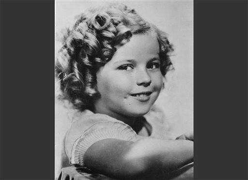 In this November 1936 file photo, 8-year-old U.S. American child movie star Shirley Temple is portrayed in Hollywood, Calif. Shirley Temple, the curly-haired child star who put smiles on the faces of Depression-era moviegoers, has died. She was 85. Publicist Cheryl Kagan says Temple, known in private life as Shirley Temple Black, died Monday night, Feb. 10, 2014, surrounded by family at her home near San Francisco.