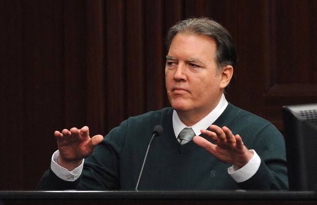 Michael Dunn takes the stand in his own defense during his trial in Jacksonville, Fla., Tuesday, Feb. 11, 2014. Dunn is charged with fatally shooting 17-year-old Jordan Davis after an argument over loud music outside a Jacksonville convenient store in 2012.