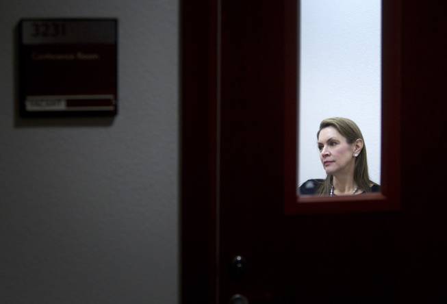 Attorney Elizabeth Quillin is shown through the window of a court conference room as she meets with a client during DUI Court at the Clark County Regional Justice Center Wednesday, Feb. 12, 2014. STEVE MARCUS