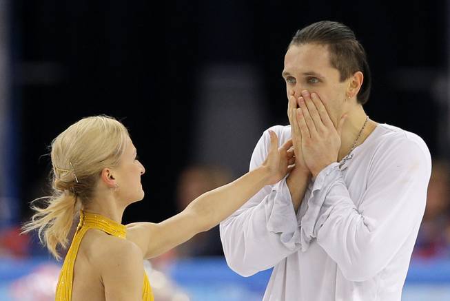 Tatiana Volosozhar and Maxim Trankov of Russia react after they competed in the pairs free skate figure skating competition at the Iceberg Skating Palace during the 2014 Winter Olympics, Wednesday, Feb. 12, 2014, in Sochi, Russia.