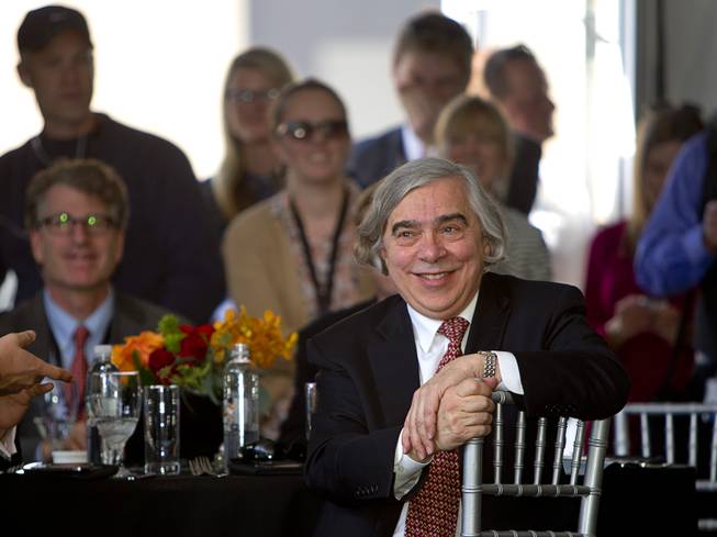 United States Secretary of Energy Ernest Moniz listens to speakers during the grand opening of the Ivanpah Solar Electric Generating System in the Mojave Desert in California near Primm, Nev. Feb. 13, 2014. The project, a partnership of NRG, BrightSource, Google and Bechtel, is the world's largest solar thermal facility and uses 347,000 sun-facing mirrors to produce 392 megawatts of electricity, enough energy to power more than 140,000 homes.