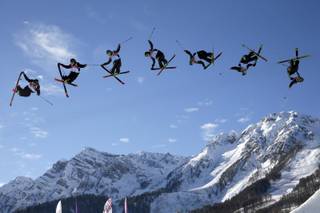In this image made with a multiple exposure, Finland's Antti Ollila competes in the men's ski slopestyle qualifying at the Rosa Khutor Extreme Park during the 2014 Winter Olympics, Thursday, Feb. 13, 2014, in Krasnaya Polyana, Russia. 