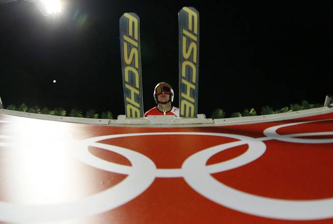 Poland's Kamil Stoch makes his jump during the men's large hill ski jumping training session at the 2014 Winter Olympics, Wednesday, Feb. 12, 2014, in Krasnaya Polyana, Russia.