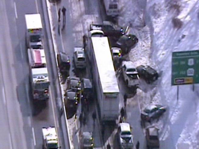 This video frame grab provided by Fox 29 Philadelphia shows traffic accidents involving multiple tractor trailers and dozens of cars on Pennsylvania Turnpike outside Philadelphia, on Friday, Feb. 14, 2014.  The crashes were reported just after 8 a.m. Friday, one day after the area got about a foot of snow that left roads slick. Television news helicopter footage showed several tractor-trailers and dozens of cars involved in a series of accidents that had backed up traffic for miles between the Bensalem and Willow Grove exits. 