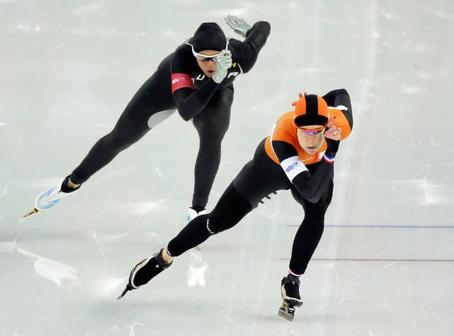 In this Thursday, Feb. 13, 2014 file photo, Brittany Bowe of the United States, left, trails behind silver medallist Ireen Wust of the Netherlands in the women's 1,000-meter speedskating race at Adler Arena during the 2014 Winter Olympics in Sochi, Russia.