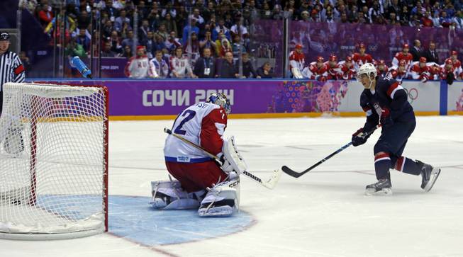 USA forward T.J. Oshie scores the winning goal against Russia goaltender Sergei Bobrovsky in a shootout during overtime of a men's ice hockey game at the 2014 Winter Olympics, Saturday, Feb. 15, 2014, in Sochi, Russia.
