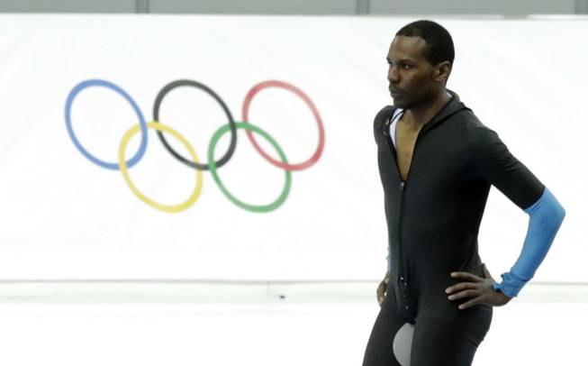 Shani Davis of the U.S. takes a breather after competing in the men's 1,500-meter speedskating race at the Adler Arena Skating Center during the 2014 Winter Olympics in Sochi, Russia, Saturday, Feb. 15, 2014. 