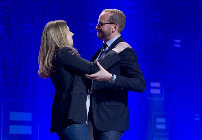 Chelsea Clinton is greeted by Chad Griffin, president of the Human Rights Campaign, as she arrives to give closing remarks during HRC's Time to Thrive conference at Bally's on Sunday, Feb. 16, 2014.