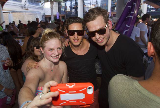 Miranda Sprague takes a selfie with Firebeatz DJs Jurre and Tim during the Halfway to EDC and first winter pool party at Marquee Dayclub on Sunday, Feb. 16, 2014, in the Cosmopolitan of Las Vegas.