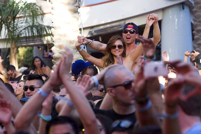 Partygoers listen to electronic dance music by Firebeatz during the Halfway to EDC and first winter pool party at Marquee Dayclub on Sunday, Feb. 16, 2014, in the Cosmopolitan of Las Vegas.