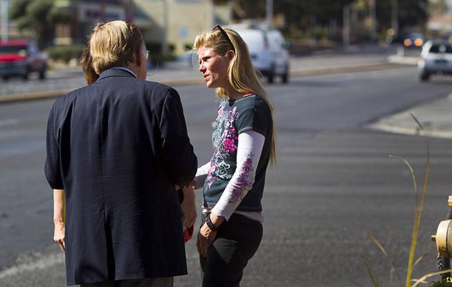 Volunteers looking for information on Jessie Foster talk with a woman who had been panhandling on the corner of Jones Boulevard and Tropicana Avenue Monday, Feb. 17, 2014. Foster, a Canadian, went missing from North Las Vegas in 2006.