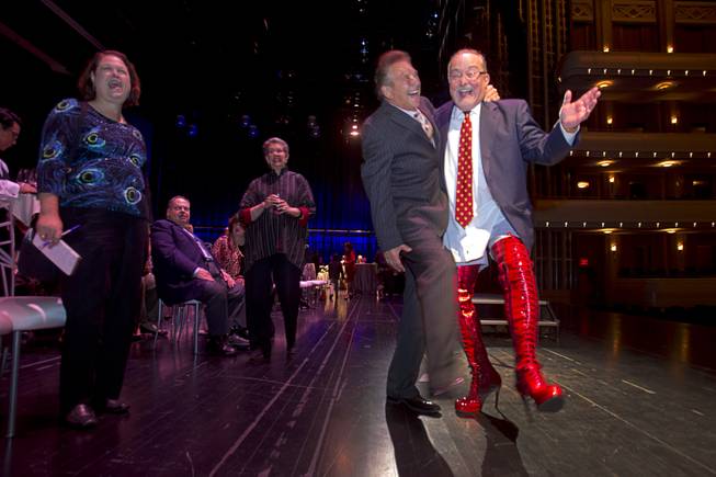 Myron Martin, president/CEO of the Smith Center for the Performing Arts, wears kinky boots as poses with Steve Schorr after announcing the 2014-2015 Broadway Las Vegas Series at the Center Tuesday, Feb. 18, 2014. The Tony Award-winning "Kinky Boots" will be coming to the Smith Center in September.