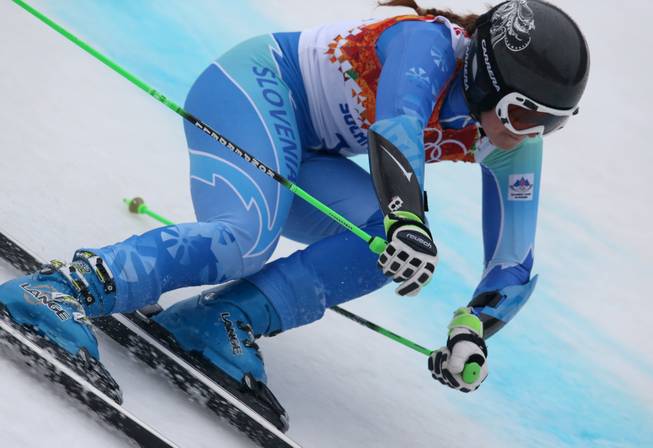 Slovenia's Tina Maze makes a turn in the second run of the women's giant slalom to win the gold medal at the Sochi 2014 Winter Olympics, Tuesday, Feb. 18, 2014, in Krasnaya Polyana, Russia.