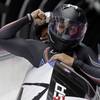 The team from the United States USA-1, piloted by Elana Meyers with brakeman Lauryn Williams, brake in the finish area after their second run during the women's two-man bobsled competition at the 2014 Winter Olympics, Tuesday, Feb. 18, 2014, in Krasnaya Polyana, Russia.