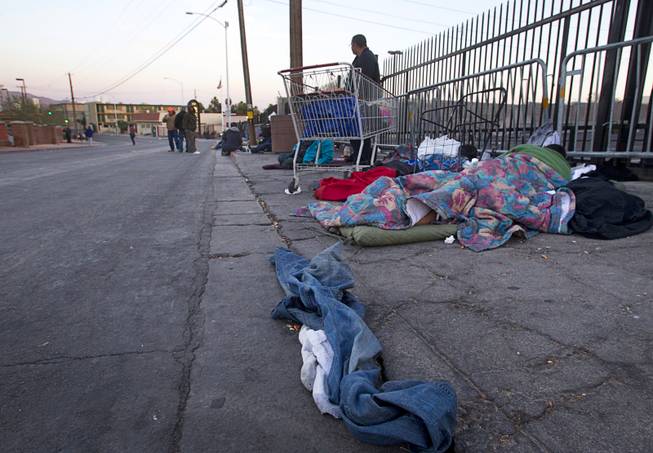 Homeless gather on Foremaster Lane near Main Street Wednesday, Feb. 19, 2014. 