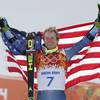 Men's giant slalom gold medalist Ted Ligety of the United States poses for photographers on the podium at the Sochi 2014 Winter Olympics, Wednesday, Feb. 19, 2014, in Krasnaya Polyana, Russia.