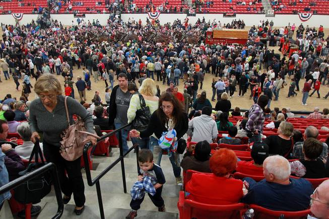 Attendees gather around to get an up close look at the Budweiser Clydesdales during an appearance at the South Point Arena Thursday, Feb. 20, 2014.