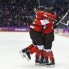 Marie-Philip Poulin of Canada (29) celebrates with teammates after scoring the tying goal against the USA during the third period of the women's gold medal ice hockey game at the 2014 Winter Olympics, Thursday, Feb. 20, 2014, in Sochi, Russia.