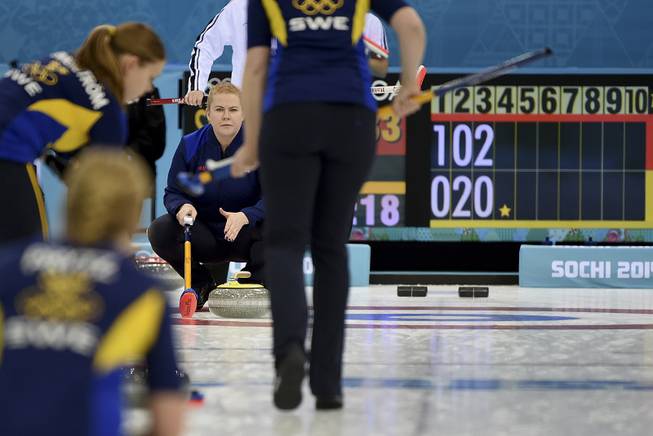 Swedish women's curler Margaretha Sigfridsson in the semifinal against the Swiss team, at the Ice Cube Curling Center in Sochi, Russia, Feb. 19, 2014. Sigfridsson and other curlers often communicate with teammates by hand signals.