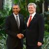 Canada's Prime Minister Stephen Harper, right, shakes hands with President Barack Obama during the North American Leaders Summit in Toluca, Mexico, Feb. 19, 2014. 