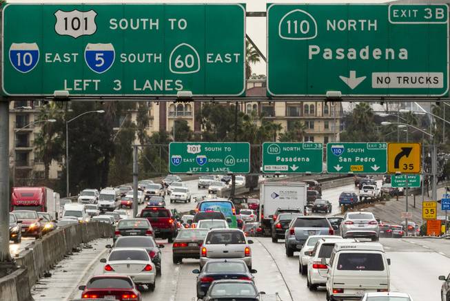 In this Thursday, Feb. 6, 2014, photo, traffic on the eastbound Hollywood Freeway approaches the four-level interchange in downtown Los Angeles.  