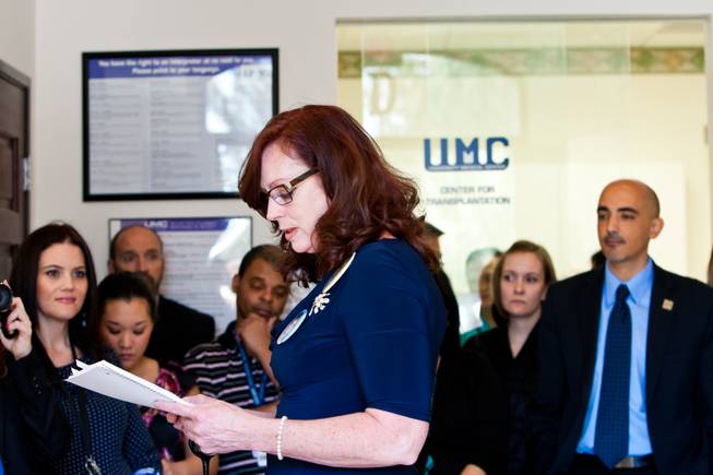 Karen Brill shares memories of her 16-year-old son Aric Michael Brill, who donated six organs following his homicide five years ago, during a ceremony celebrating his life at the UMC Transplant Center Friday, February 21, 2014.