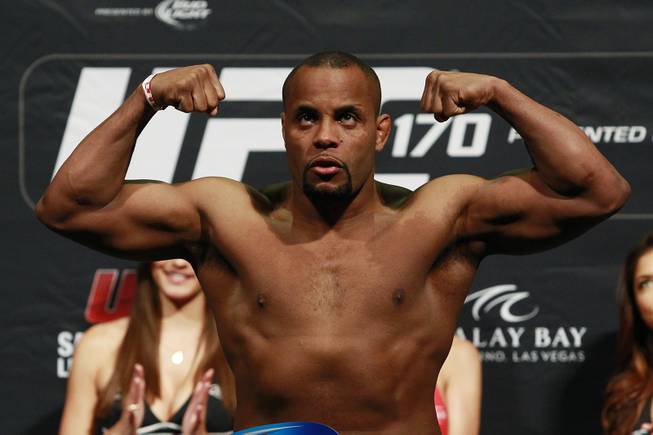 Light heavyweight Daniel Cormier flexes after making weight during the weigh in for UFC 170 Friday, Feb. 21, 2014 at the Mandalay Bay Events Center.