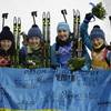 From left, Ukraine's relay team Vita Semerenko, Juliya Dzhyma, Olena Pidhrushna and Valj Semerenko pose with an Ukraine's flag, after winning the gold medal in the women's biathlon 4x6k relay at the 2014 Winter Olympics, Friday, Feb. 21, 2014, in Krasnaya Polyana, Russia.
