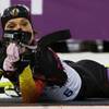 In this Feb. 9, 2014, file photo, Germany's Evi Sachenbacher-Stehle prepares to shoot during the women's biathlon 7.5k sprint, at the 2014 Winter Olympics, in Krasnaya Polyana, Russia.