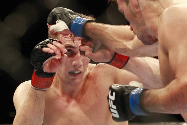 Rory MacDonald looks for an opening on Demian Maia  during their fight at UFC 170 Saturday, Feb. 22, 2014 at the Mandalay Bay Events Center.