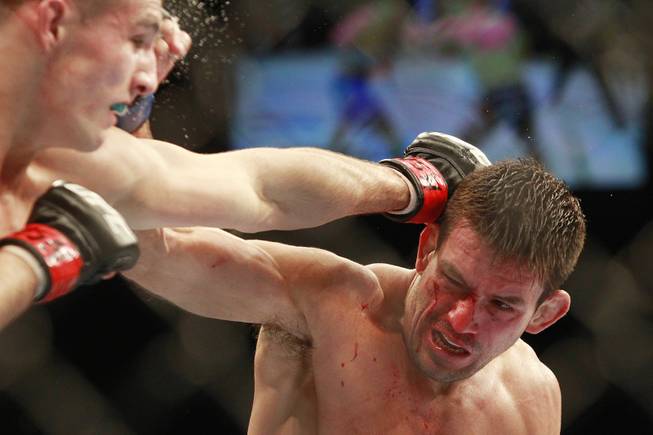 Rory MacDonald hits Demian Maia with a left during their fight at UFC 170 Saturday, Feb. 22, 2014 at the Mandalay Bay Events Center.