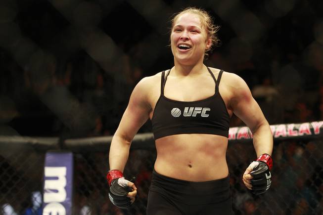 Champion Ronda Rousey celebrates after her first round TKO of Sara McMann at UFC 170 Saturday, Feb. 22, 2014 at the Mandalay Bay Events Center.