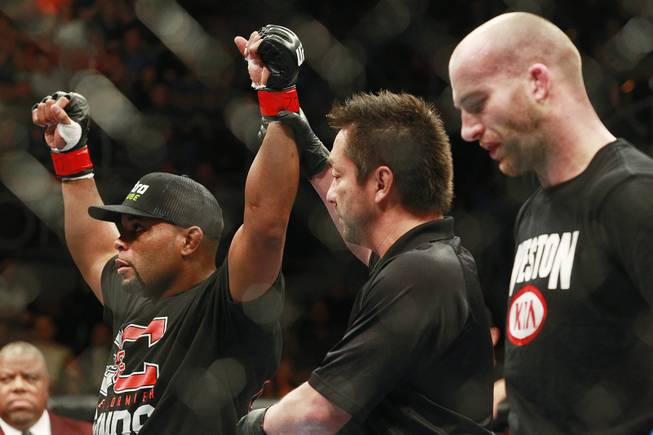 Referee Mario Yamasaki raises Daniel Cormier's arm after his defeat of Patrick Cummins at UFC 170 Saturday, Feb. 22, 2014 at the Mandalay Bay Events Center. Cormier won by TKO in the first round.