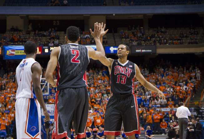 UNLV's Khem Birch and Bryce Dejean-Jones celebrate a play in the Rebels' 91-90 overtime loss to Boise State at Taco Bell Arena in Boise on Saturday, Feb. 22, 2014.