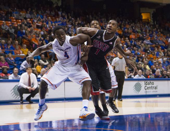 Boise State's Thomas Bropleh and UNLV's Roscoe Smith battle for position in UNLV's 91-90 overtime loss to Boise State at Taco Bell Arena in Boise on Saturday, Feb. 22, 2014.