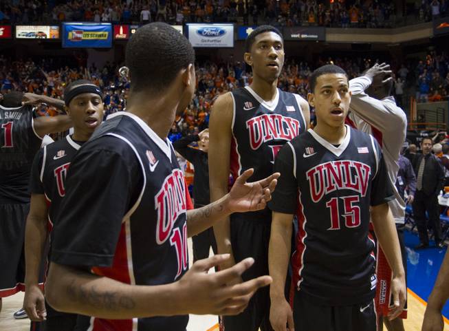 UNLV players Kevin Olekaibe, from left, Daquan Cook, Christian Wood and Kendall Smith are stunned by the ending of UNLV's 91-90 overtime loss to Boise State at Taco Bell Arena in Boise on Saturday, Feb. 22, 2014.