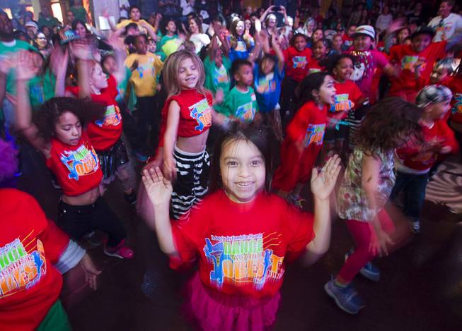Children warm-up for dance instructions during the second annual Dance Against Obesity Camp at the Marquee nightclub in the Cosmopolitan Las Vegas Sunday, Feb. 23, 2014. The free dance clinic was sponsored by TAO Cares and the Jump for Joy Foundation. While the children learned dance moves, parents participated in nutritional seminars.