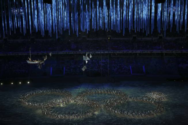 In a nod to a malfunction in the Opening Ceremonies, a group of performers form a shape of the Olympic Rings during the closing ceremony for the 2014 Winter Olympics at Fisht Olympic Stadium in Sochi, Russia, Feb. 23, 2014. (Josh Haner/The New York Times).