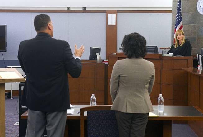 Norman Reed, left, and Jasmin Spells, attorneys for Elinor Indico, make arguments to Judge Stefany Miley during a hearing at the Regional Justice Center Monday, Feb. 24, 2014. Indico is accused of stabbing her pregnant sister-in-law to death in October 2013.
