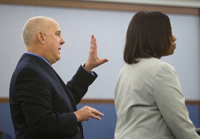 Prosecutors David Stanton, left, and Tierra Jones, make arguments to Judge Stefany Miley during a hearing for Elinor Indico at the Regional Justice Center Monday, Feb. 24, 2014. Indico is accused of stabbing her pregnant sister-in-law to death in October 2013.