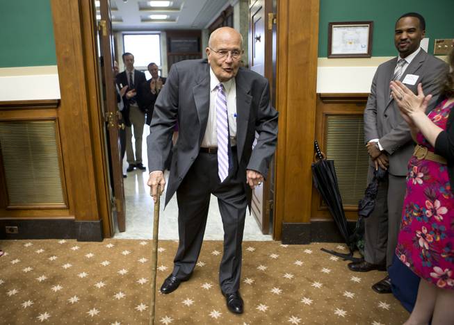 In this June 7, 2013, fie photo, Rep. John Dingell, D-Mich., is celebrated by friends and colleagues on Capitol Hill in Washington, as he becomes the longest-serving member of Congress in history.