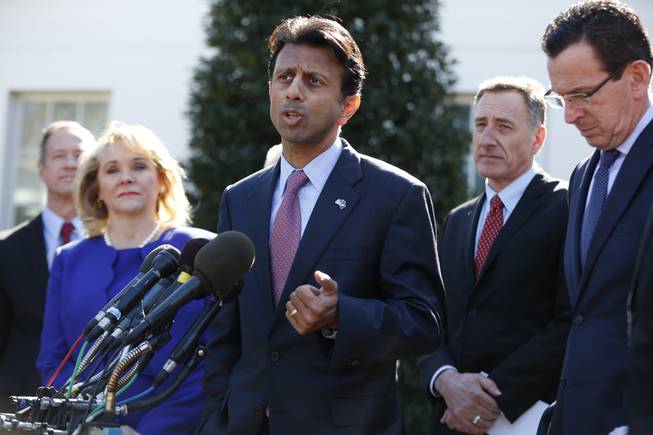 Louisiana Gov. Bobby Jindal, center, speaks to reporters outside the White House in Washington, Monday, Feb. 24, 2014, following a meeting between President Barack Obama and members of the National Governors Association (NGA). From left are, Maryland Gov. Martin O'Malley, NGA Chair, Oklahoma Gov. Mary Fallin, Jindal, Vermont Gov. Peter Shumlin, and Connecticut Gov. Dannel Malloy.