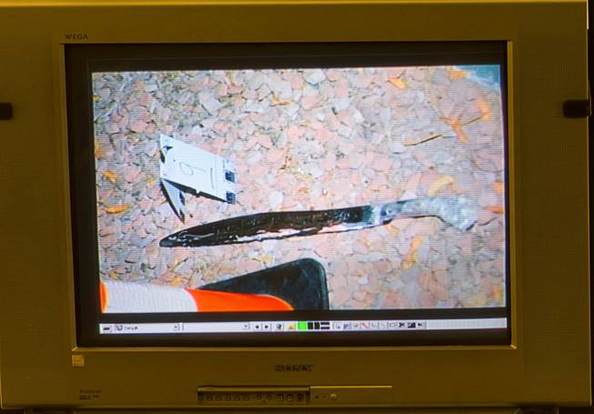 An evidence photo showing a machete is displayed on a video monitor during a trial for Armando Vergara-Martinez at the Clark County Regional Justice Center Tuesday, Feb. 25, 2014. Martinez is accused of attacking Maria Gomez with a machete in the parking lot of a North Las Vegas convenience store in 2012.