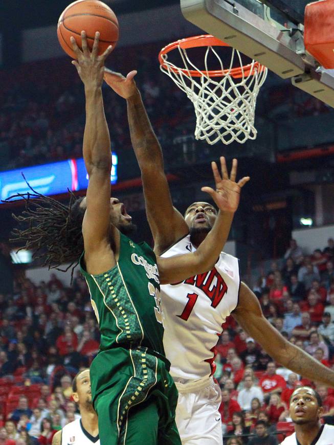 UNLV forward Roscoe Smith defends a shot by Colorado State Dwight Smith during the first half of their Mountain West Conference game Wednesday, Feb. 26, 2014 at the Thomas & Mack Center.