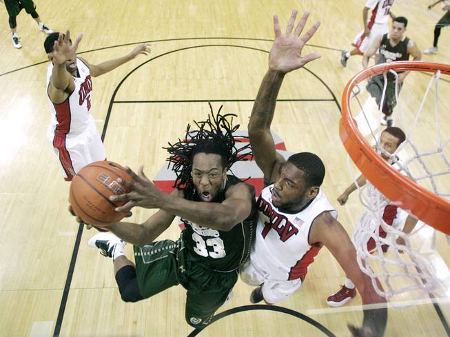 UNLV forward Roscoe Smith defends Colorado State guard Dwight Smith during their Mountain West Conference game Wednesday, Feb. 26, 2014 at the Thomas & Mack Center. UNLV won 78-70.